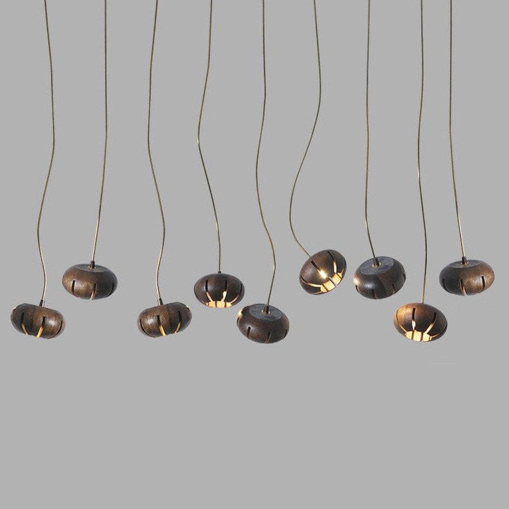 Wooden flower petal strip on copper wire pendant light
