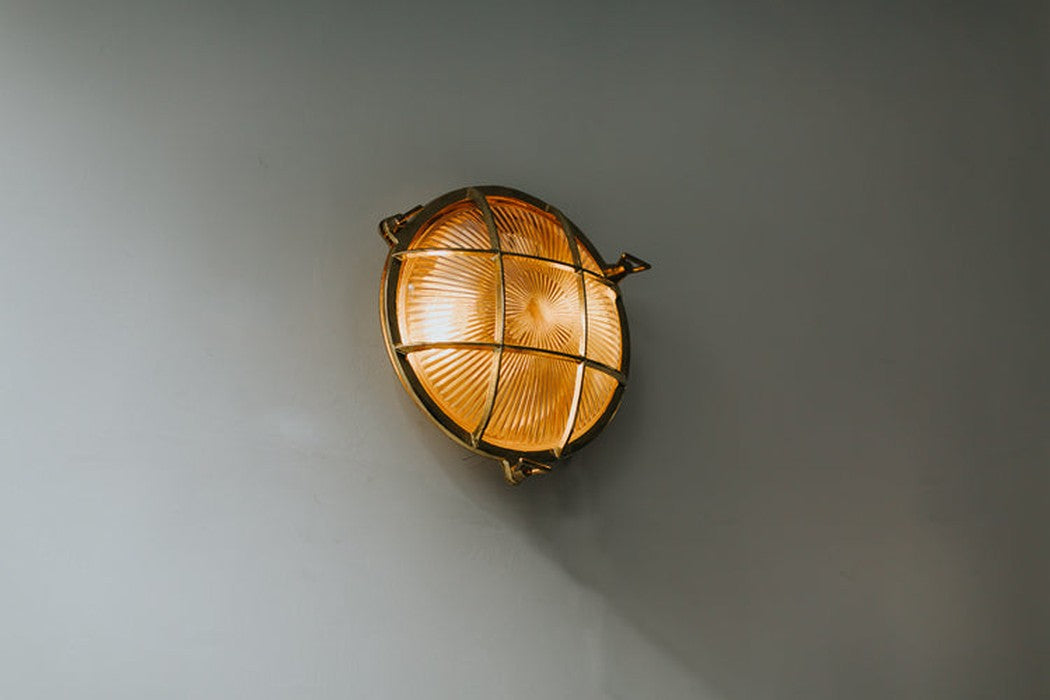 Nautilus Round Brass cage outdoor wall light / ceiling light