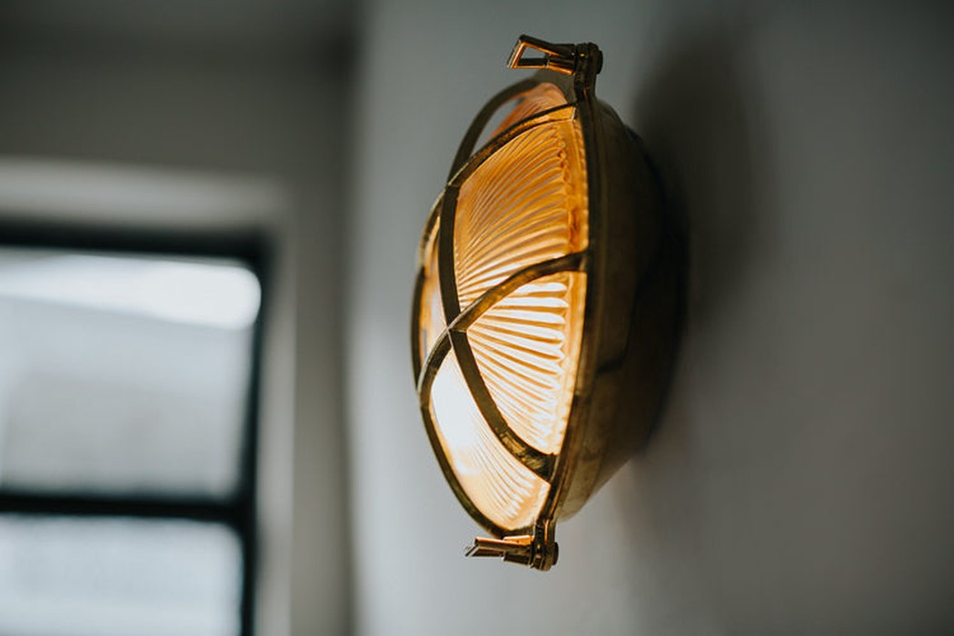 Nautilus Round Brass cage outdoor wall light / ceiling light