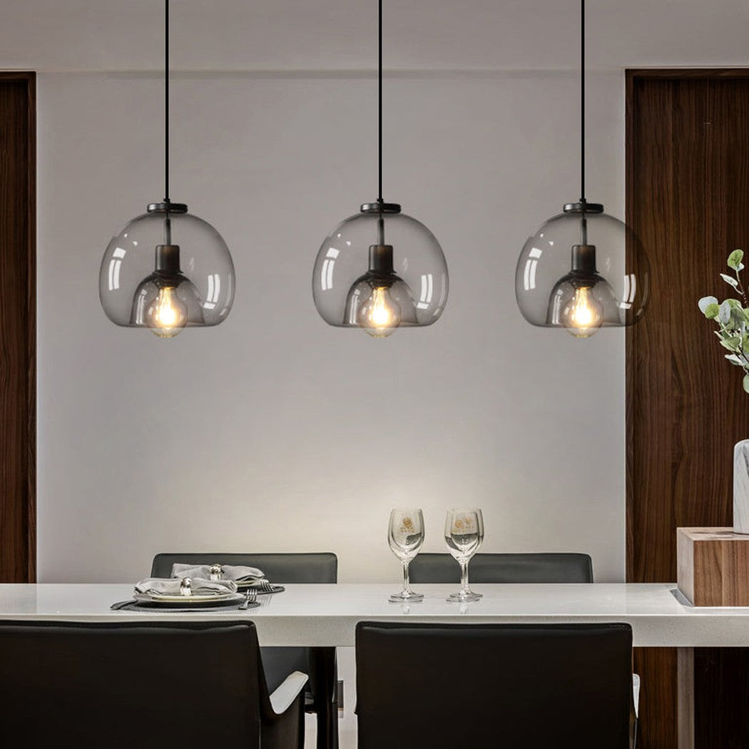 Enzo minimalist curve tinted glass shade pendant light in dining room setting