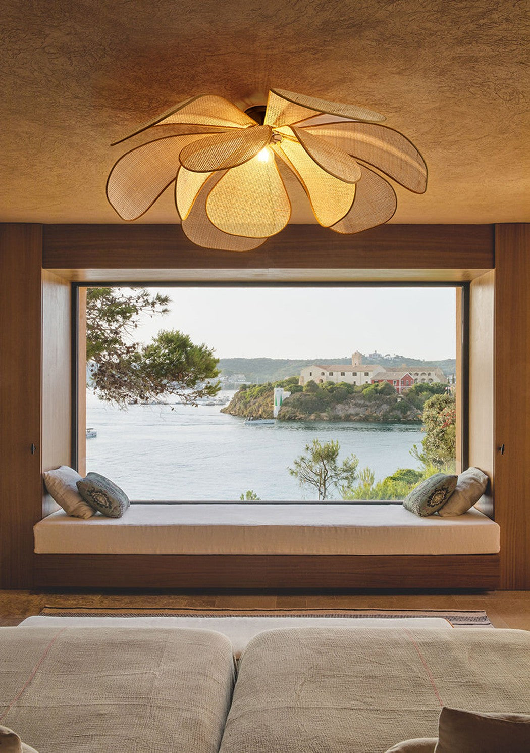 Cefalu Rattan Petals Floral Pendant Light installed in minimalist style all wooden interior