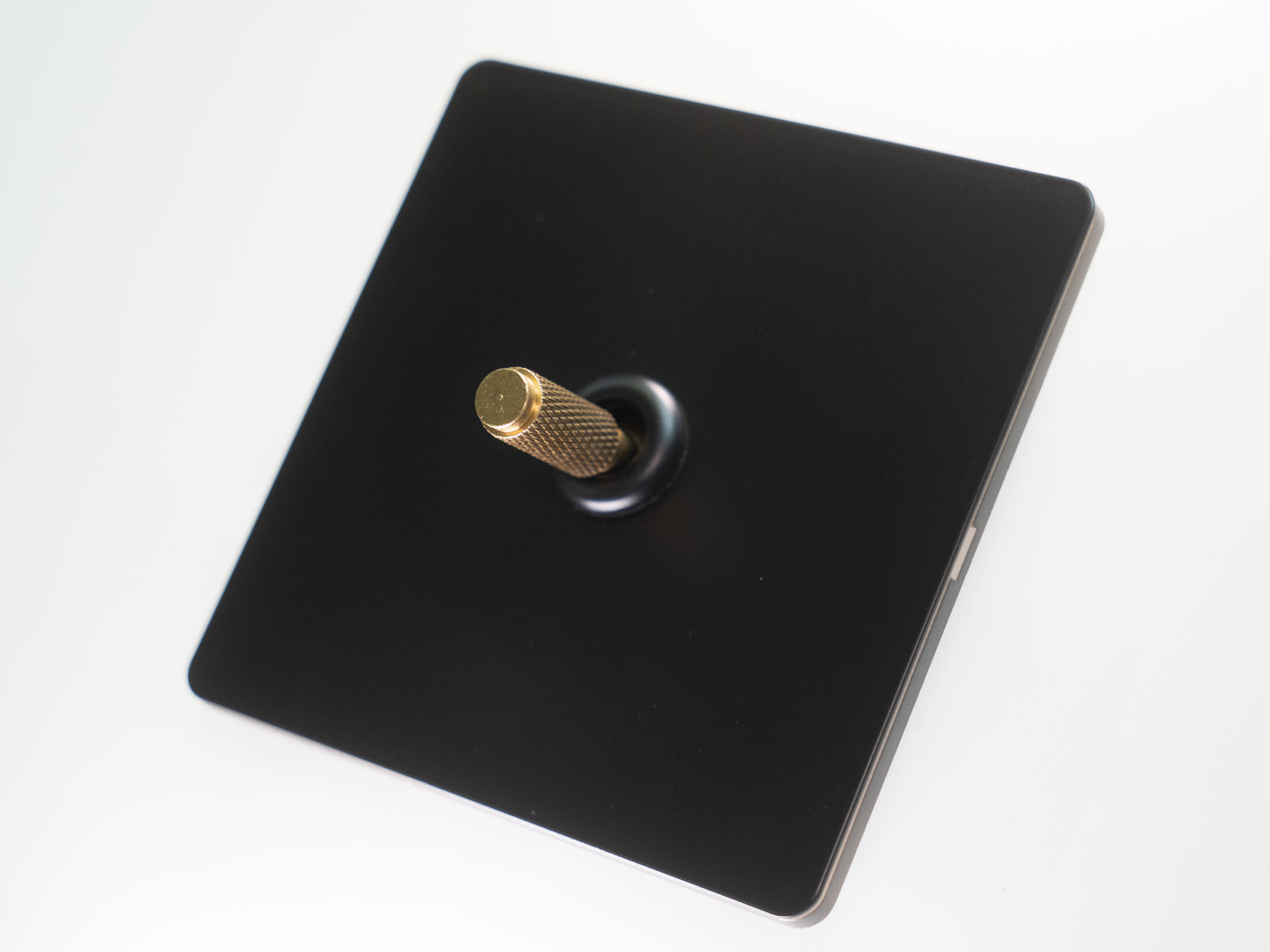 Paddington Knurled 1 gang single flip light switch - in black and brass
