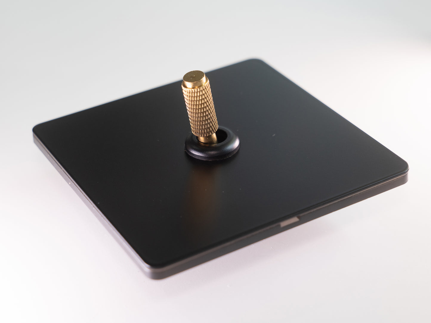 Paddington Knurled 1 gang single flip light switch - in black and brass