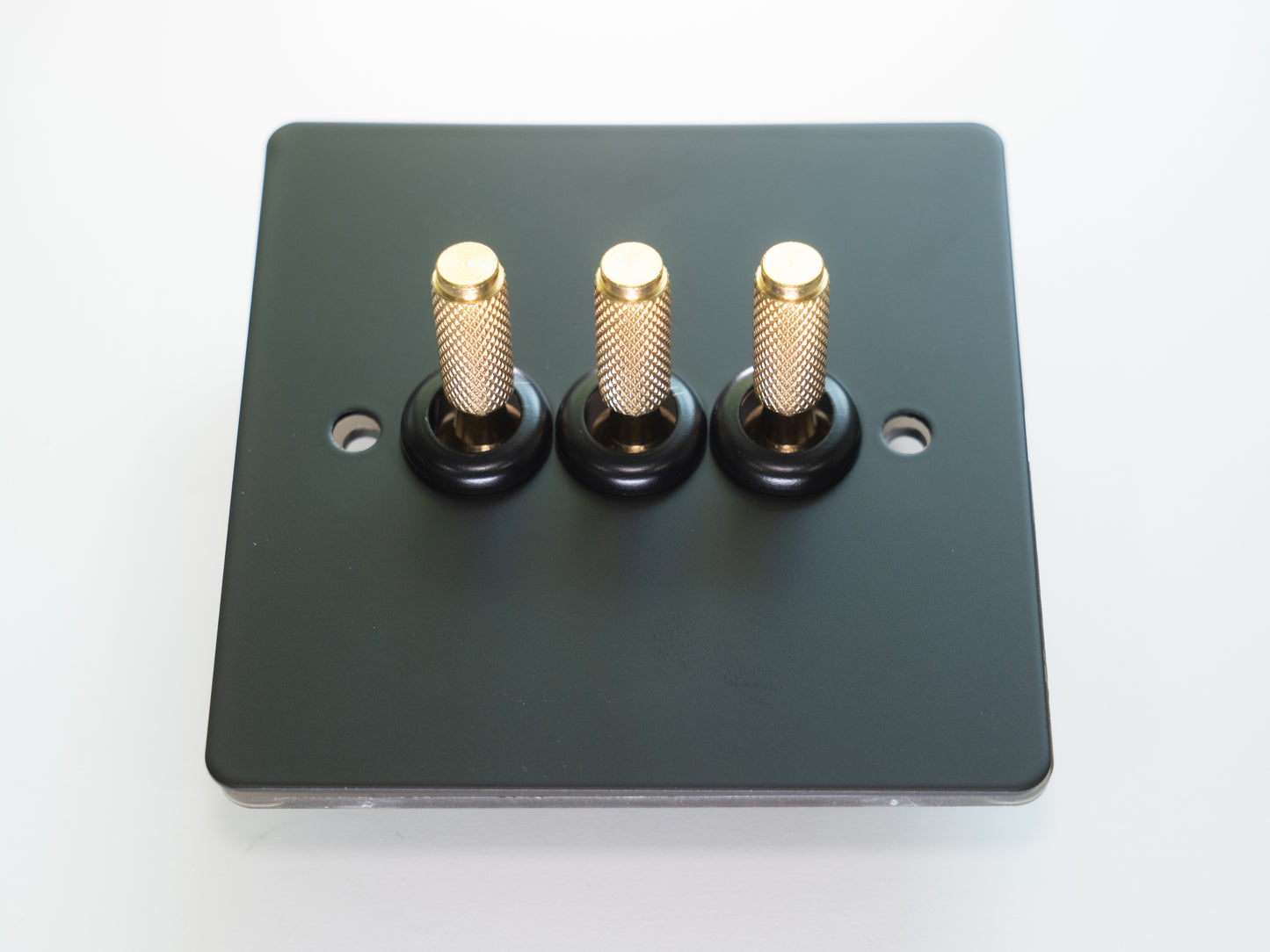 Paddington Knurled 3 gang Tri flip light switch - in black and brass