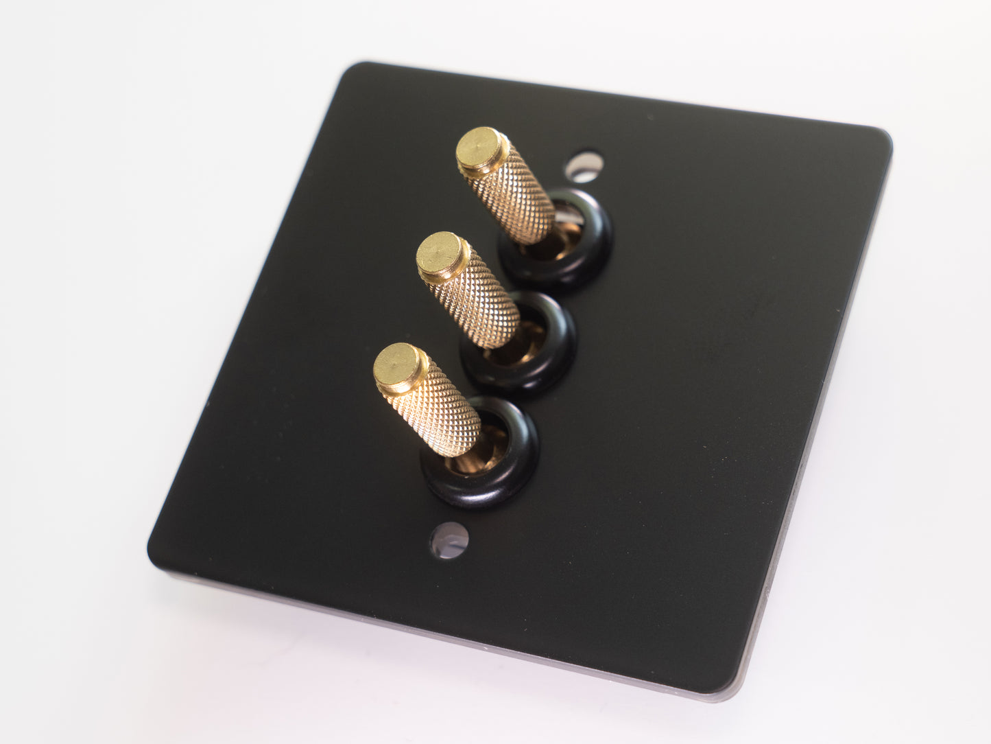 Paddington Knurled 3 gang Tri flip light switch - in black and brass