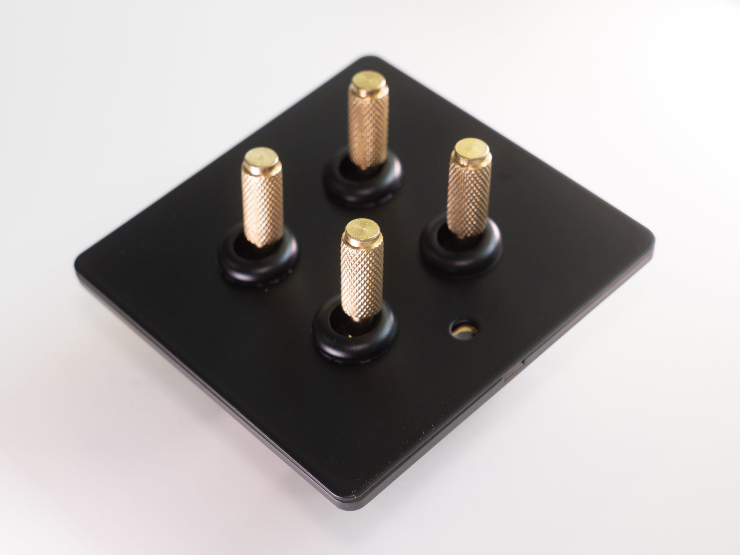 Paddington Knurled 4 gang quad flip light switch - in black and brass