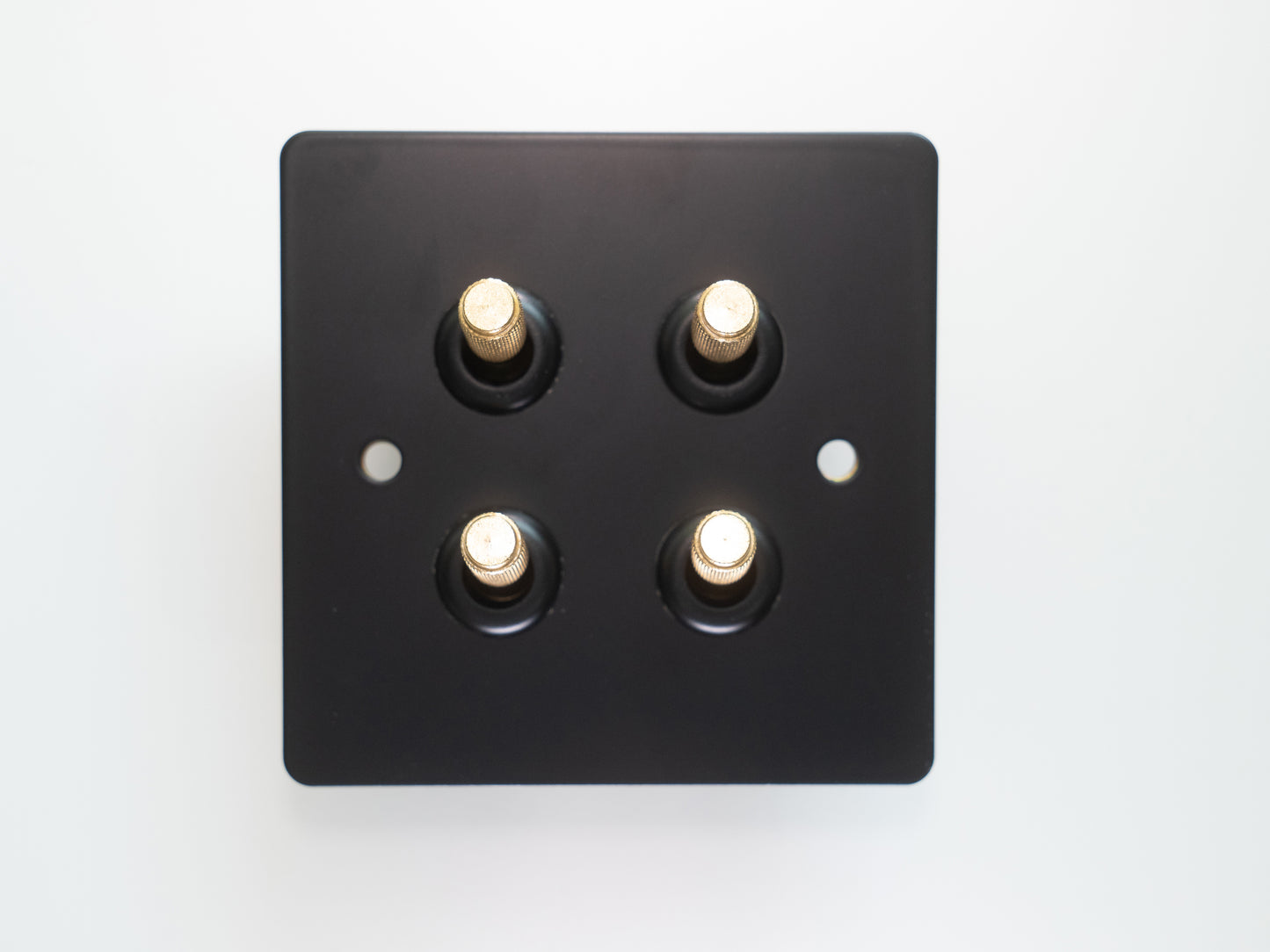 Paddington Knurled 4 gang quad flip light switch - in black and brass