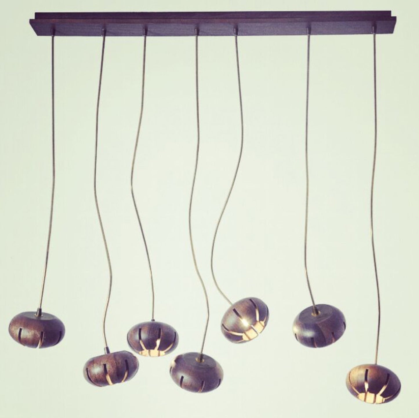 Wooden flower petal strip on copper wire pendant light