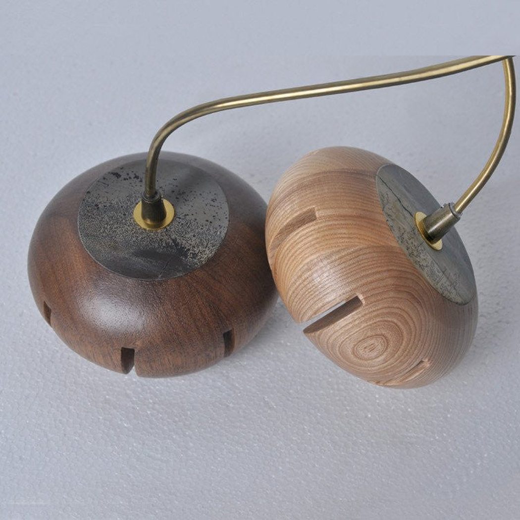 Wooden flower petal strip on copper wire pendant light dark wood light wood close up