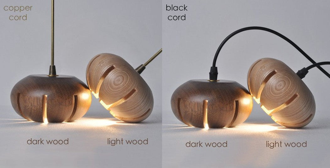 Wooden flower petal strip on copper wire pendant light dark wood light wood close up