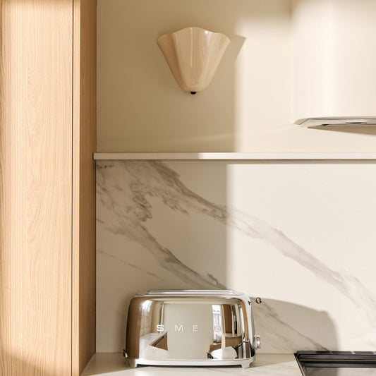 organic and charming light fixture for a warm beige toned minimalist kitchen