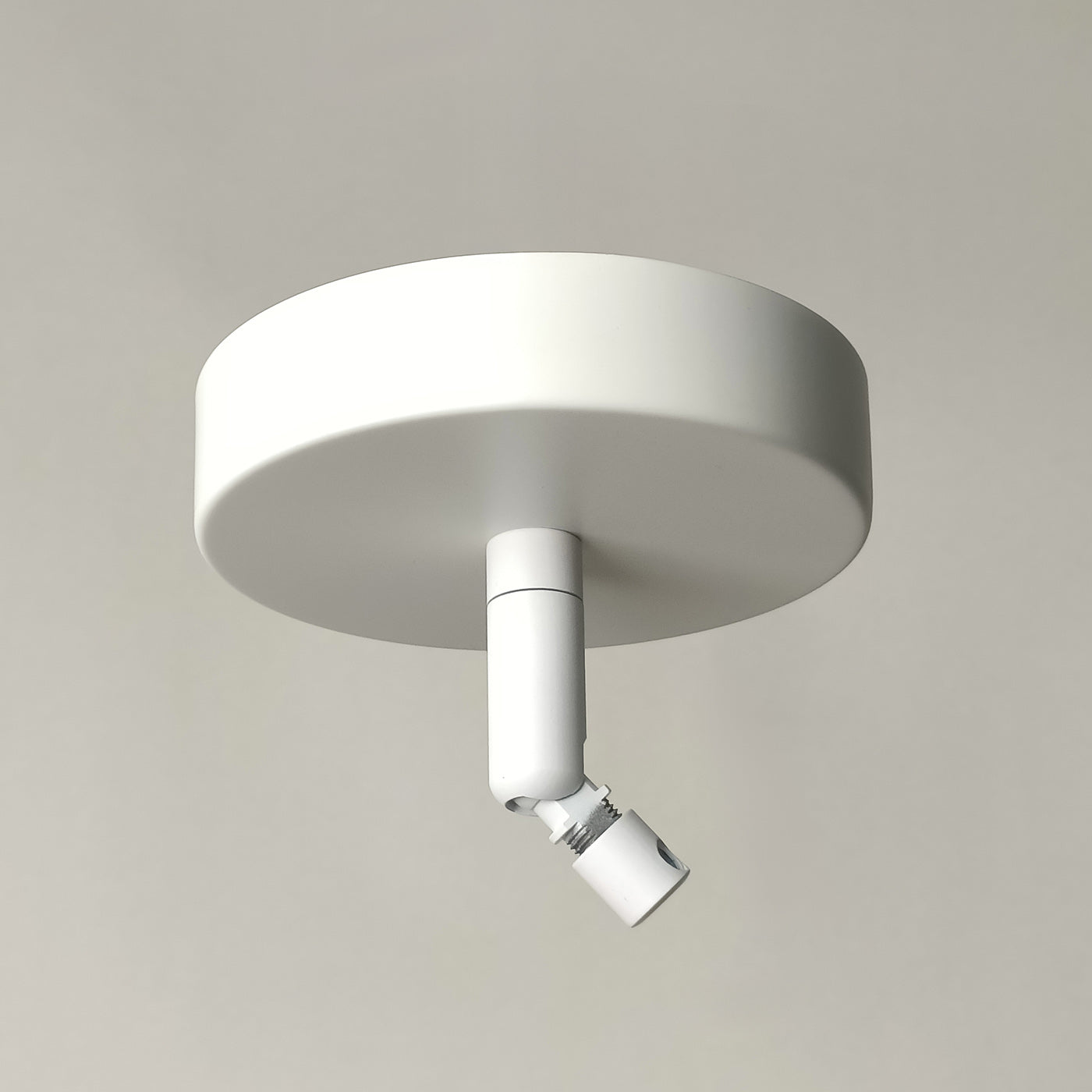Ceiling rose for sloped ceilings