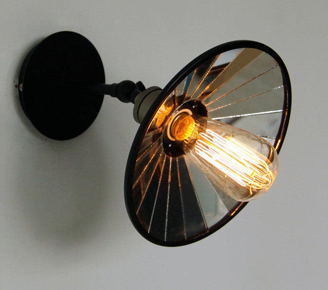 Vintage industrial look wall sconce light with black lamp shade with mirror inside.