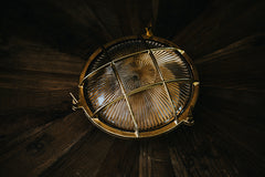 Nautilus Round Brass cage outdoor wall light / ceiling light