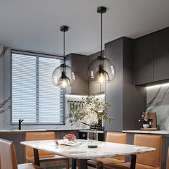 Enzo minimalist curve tinted glass shade pendant light luxurious kitchen setting