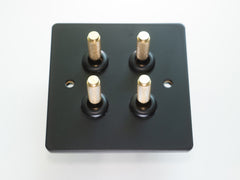 Paddington Knurled 4 gang quad flip light switch - in black and brass