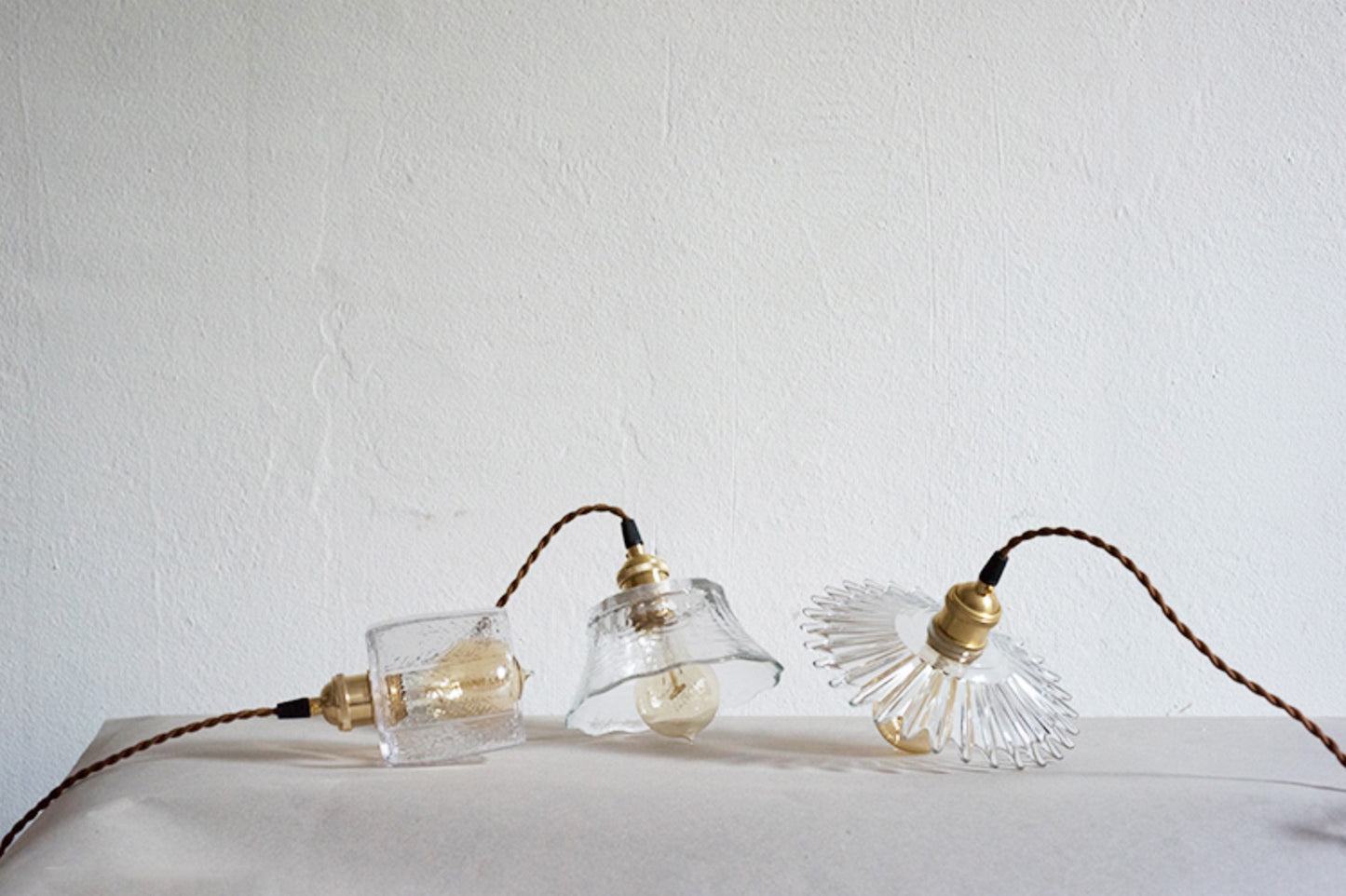 Petunia glass mid century pendant lights on table