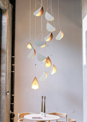 White glider pendant light chandelier dining room setting