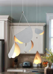 White glider pendant light chandelier kitchen setting