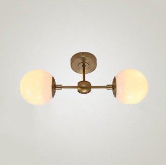 Brushed brass frost bulb wall light sconce